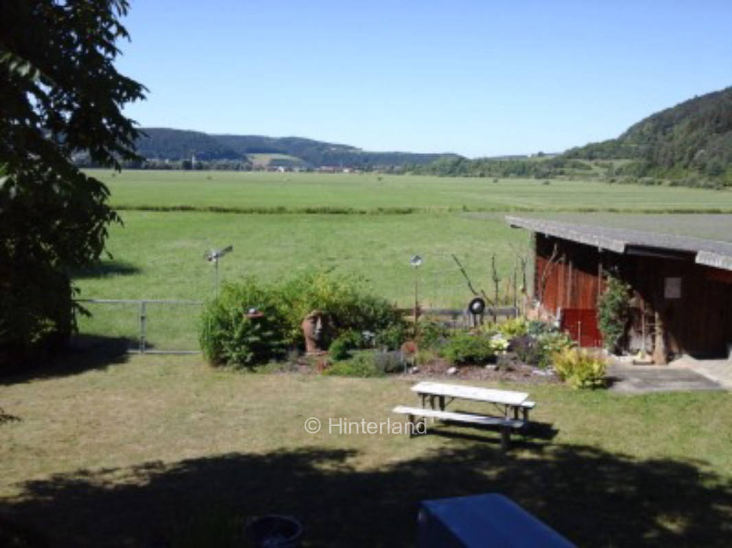 Garden place with view over meadow on Danube cycle path