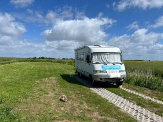 Place between dike and marsh with a far view