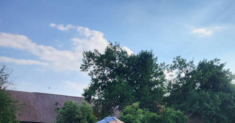 Relaxation in the green on the fruit meadow with barbecue area