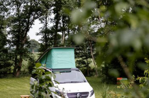 Pitch in the meadow by the thatched cottage
