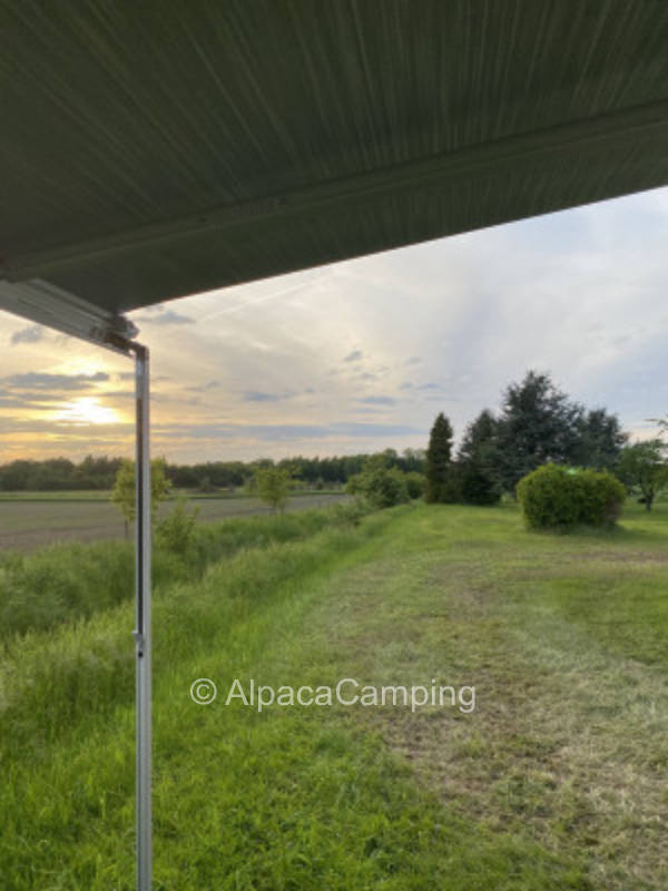 Meadow with far view of Unna and fields at the ditch