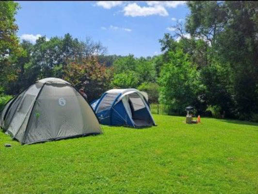 Tent meadow with stream in the Eifel
