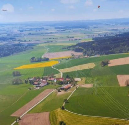 On the farm with a view over the foothills of the Alps