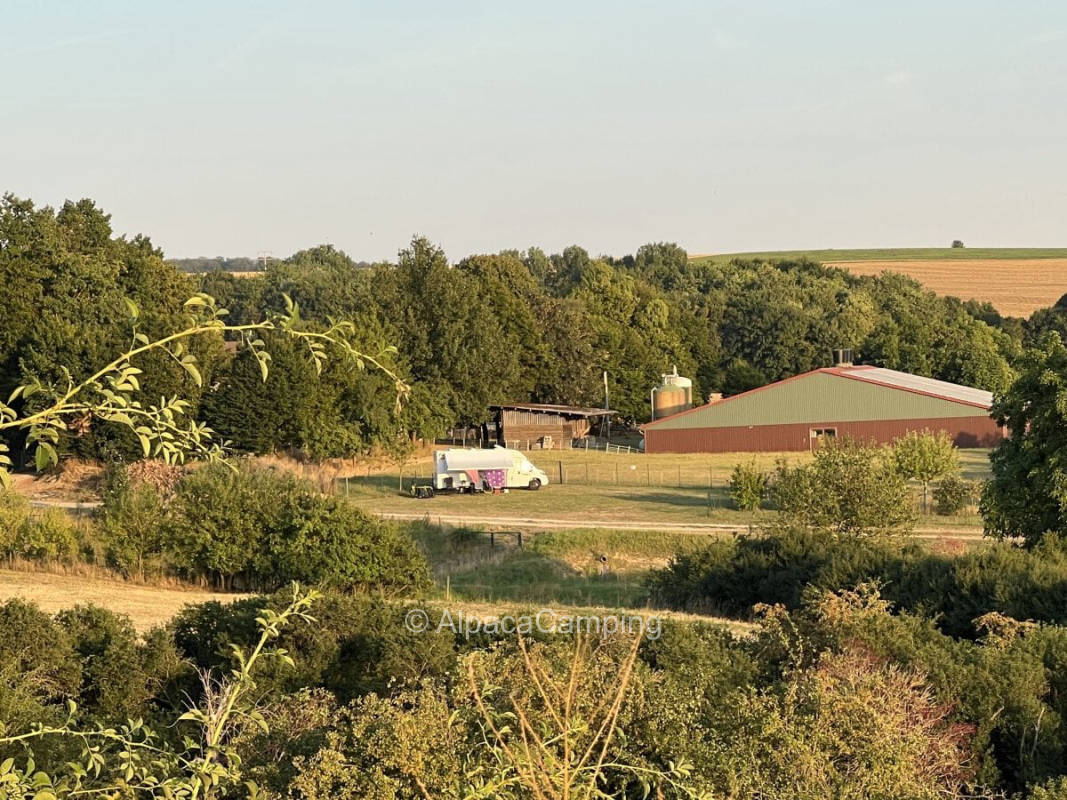 Picturesque campsite on a lush green meadow with beautiful far view #1
