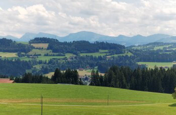 Farm camping in the countryside with mountain views