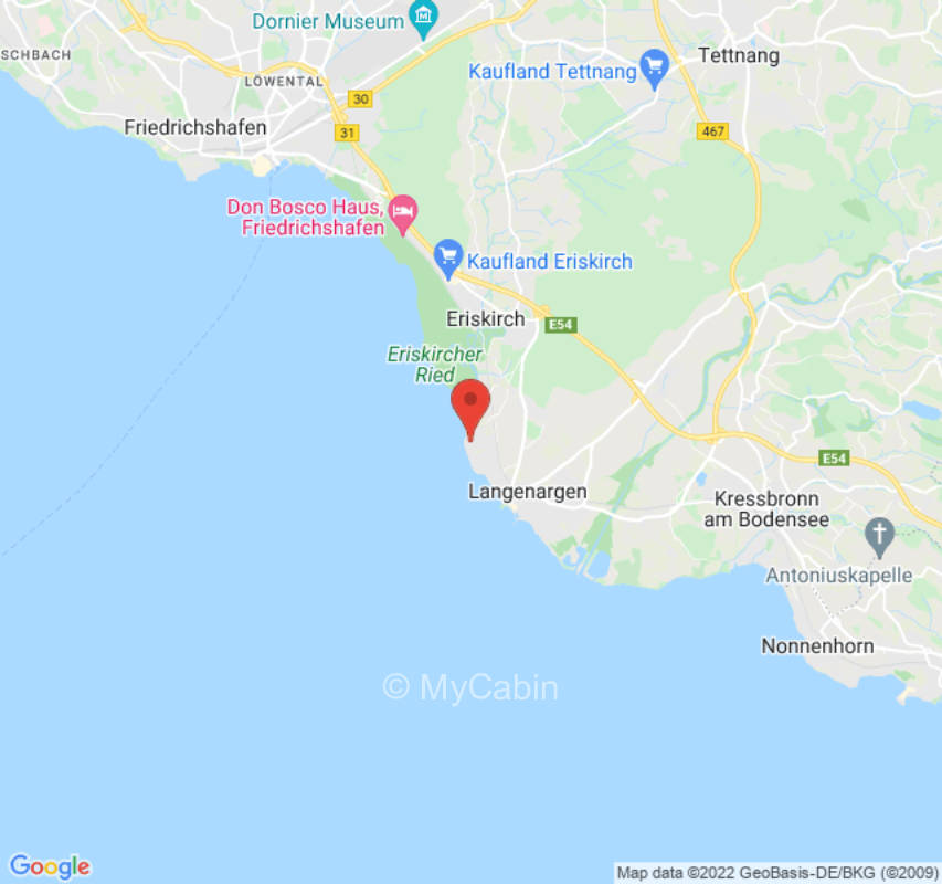 Park and beach with a view of the Swiss mountains