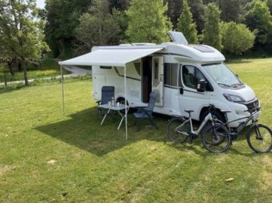 Motorhome parking area at the forest edge