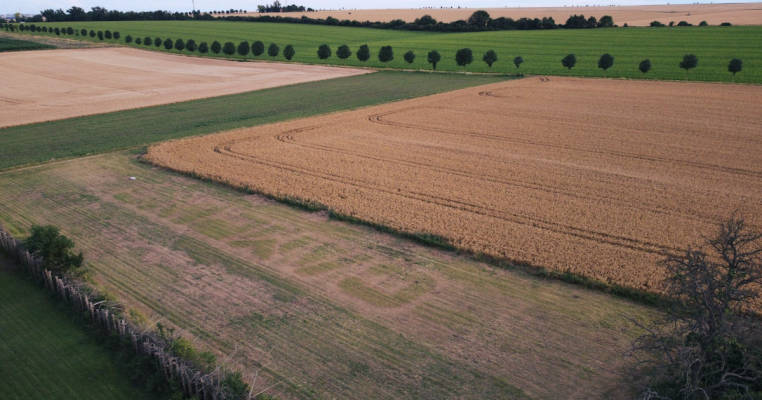 Camping pitch surrounded by wide fields