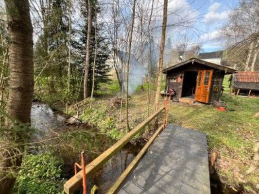 Pitch by the stream with barbecue area and cottage