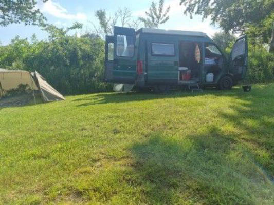 Camping in nature with a small bathing spot