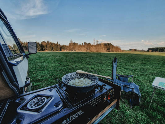 Pitch with caravan by the river